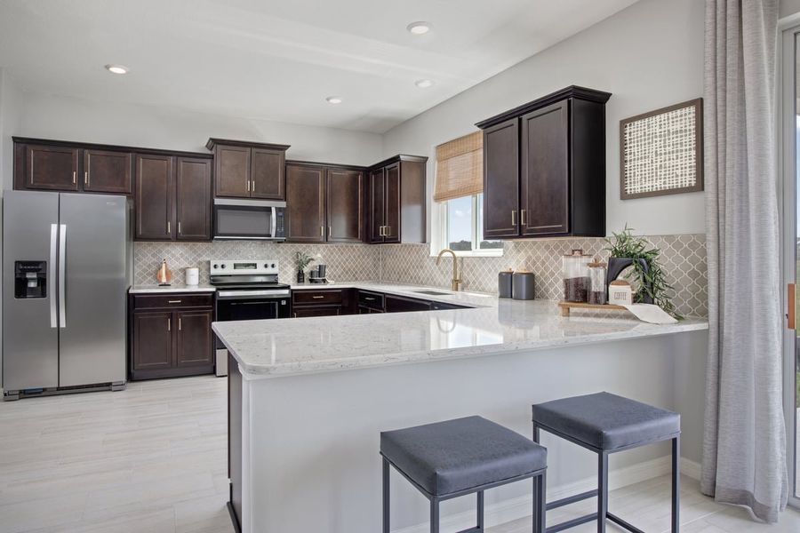 Representative furnished interior of a home built from the Plan 2107 Modeled by KB Home in The Preserve at Legends Pointe I, Hudson (Image 4). Representative furnished interior of a home built from the Plan 2107 Modeled by KB Home in The Preserve at Legends Pointe I, Hudson (Image 4).