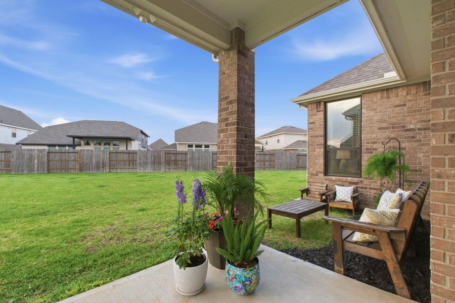 Exterior details and patio area of a home in Sunterra 45ft, Katy (Image 4).