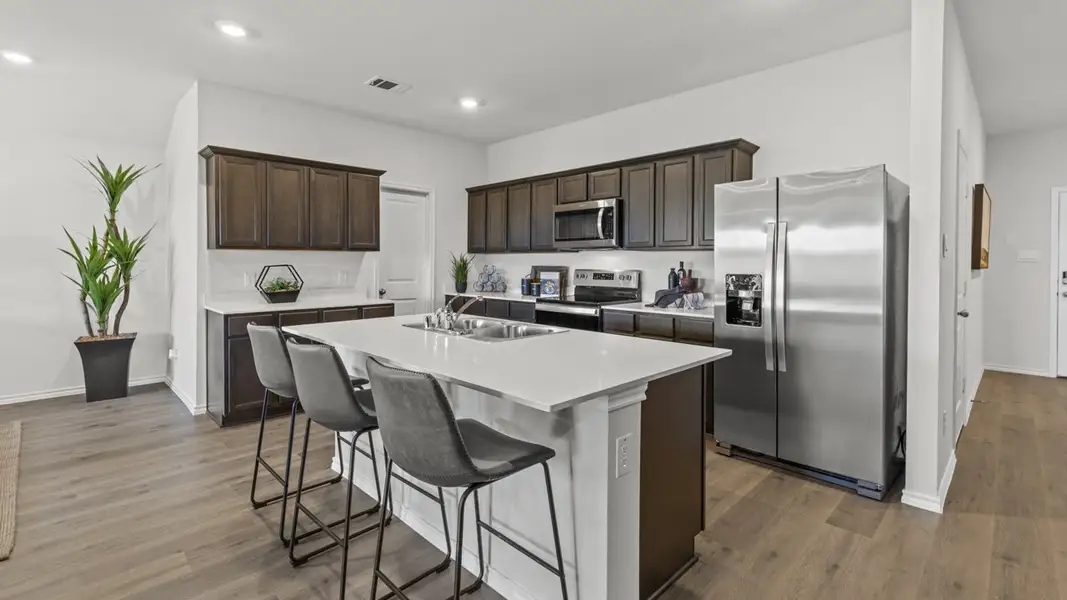 Furnished interior view inside a new home in Windrose, Pilot Point (Image 3).