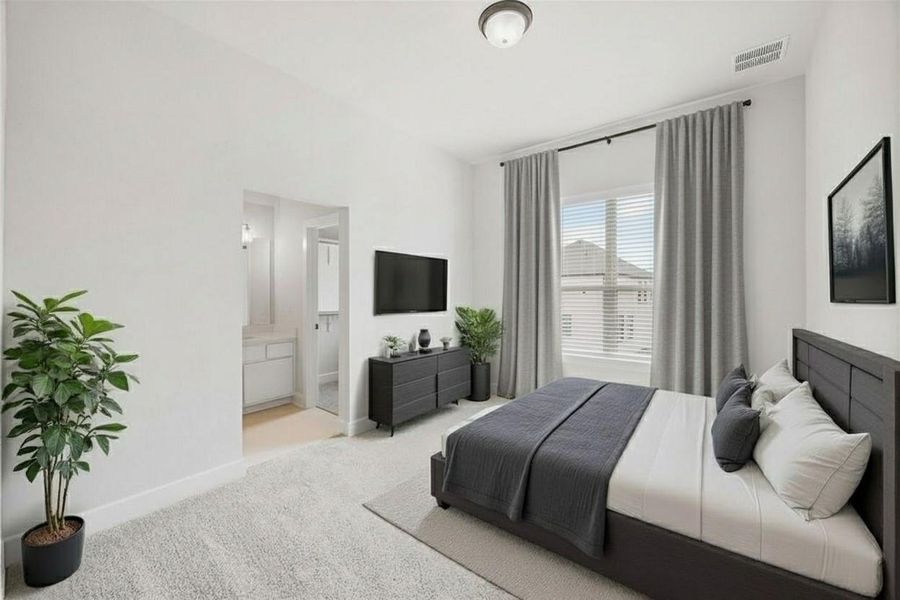 Bedroom with carpet flooring and ensuite bathroom