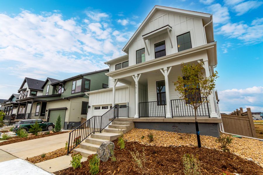 Front exterior of a new home in West Grange, Longmont, CO, highlighting curb appeal (Image 27).