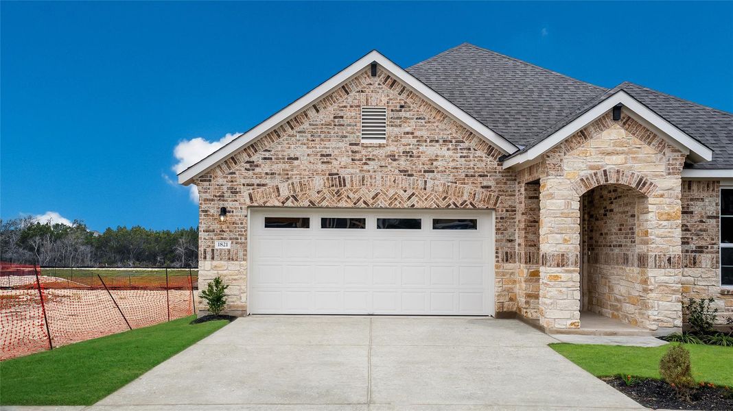 Front exterior of a new home in Rosenbusch Ranch, Leander, TX, highlighting curb appeal (Image 1). Front exterior of a new home in Rosenbusch Ranch, Leander, TX, highlighting curb appeal (Image 1).