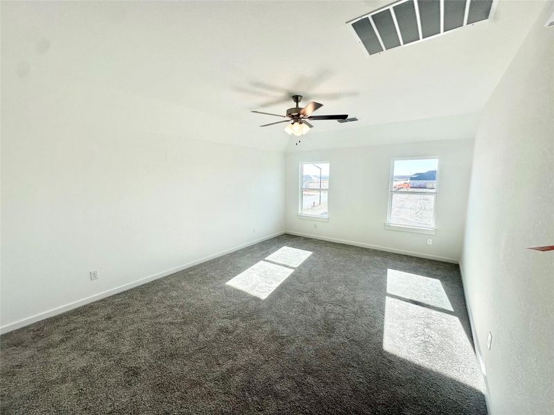 Spare room with carpet flooring and a ceiling fan
