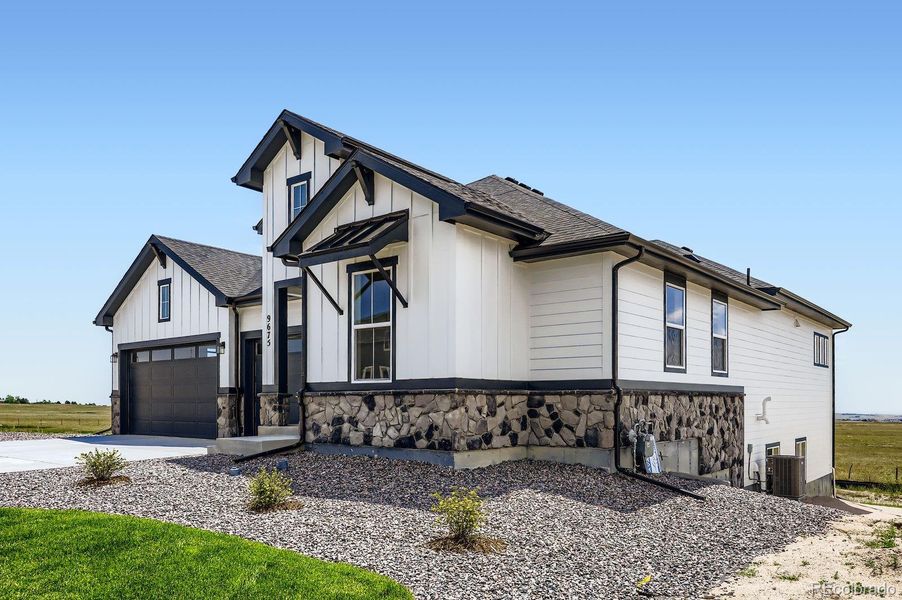 Front exterior of a new home in Timber Ridge, Colorado Springs, CO, highlighting curb appeal (Image 2).