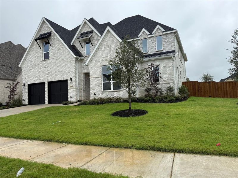 View of front of home featuring brick siding, concrete driveway, a shingled roof, and a garage View of front of home featuring brick siding, concrete driveway, a shingled roof, and a garage