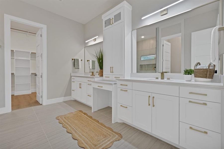 Bathroom with vanity, baseboards, a shower, and tile patterned floors Bathroom with vanity, baseboards, a shower, and tile patterned floors