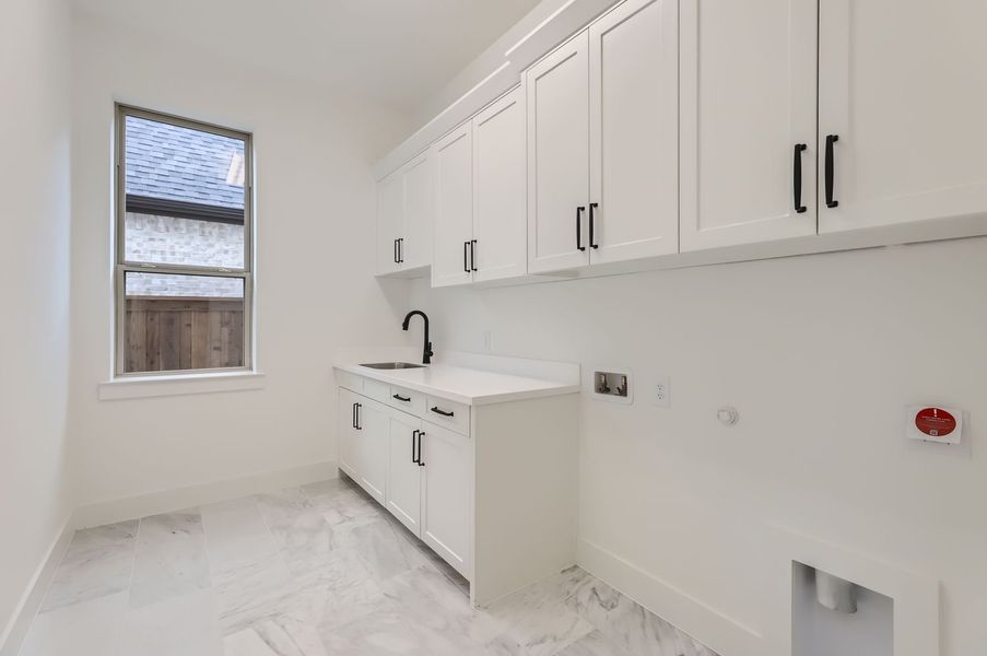 Plan 1571 laundry room representative photo