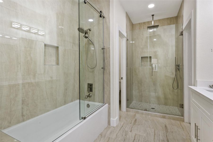 Primary bedroom has the tub combo and walk in shower options