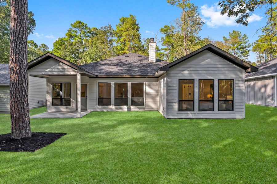 Front exterior of a new home in , Trinity, TX, highlighting curb appeal (Image 1).