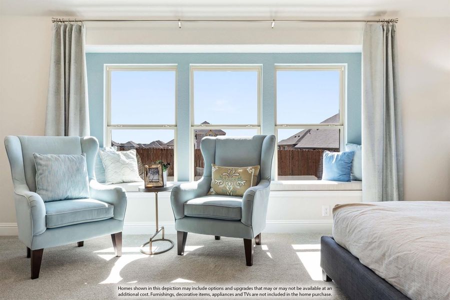 Bedroom sitting area with two blue wingback chairs, window seat, and triple windows with gray curtains Bedroom sitting area with two blue wingback chairs, window seat, and triple windows with gray curtains