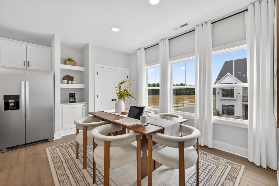 Representative furnished interior of a home built from the Cora End Unit by Baker Residential in Atwater Station - Midtown Collection, Fuquay Varina (Image 12). Representative furnished interior of a home built from the Cora End Unit by Baker Residential in Atwater Station - Midtown Collection, Fuquay Varina (Image 12).