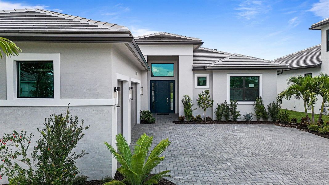 Exterior details and patio area of a home in Cresswind Palm Beach at Westlake, The Acreage (Image 4).