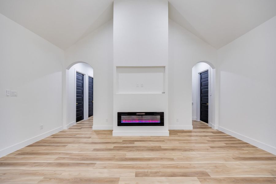 Stunning electric fireplace serving as a stylish focal point, creating warmth and ambiance in the inviting living space. Stunning electric fireplace serving as a stylish focal point, creating warmth and ambiance in the inviting living space.