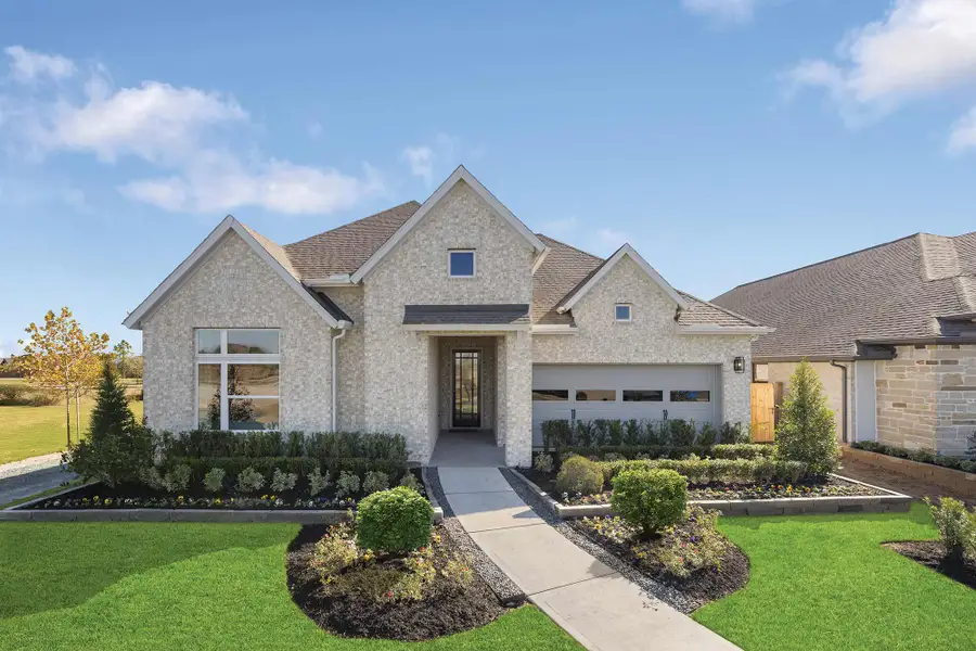 Representative exterior photo of a completed home built from the The Begonia by David Weekley Homes in Prairieland Village - Summit Collection, Cypress, TX (Image 1). Representative exterior photo of a completed home built from the The Begonia by David Weekley Homes in Prairieland Village - Summit Collection, Cypress, TX (Image 1).