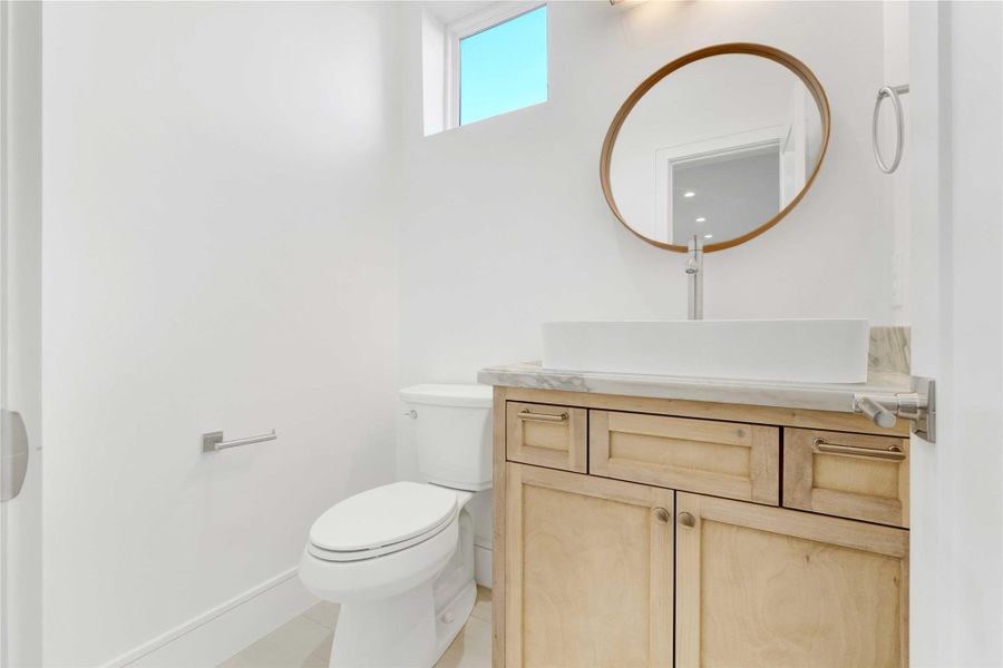 Half bath with custom builds on the second floor.