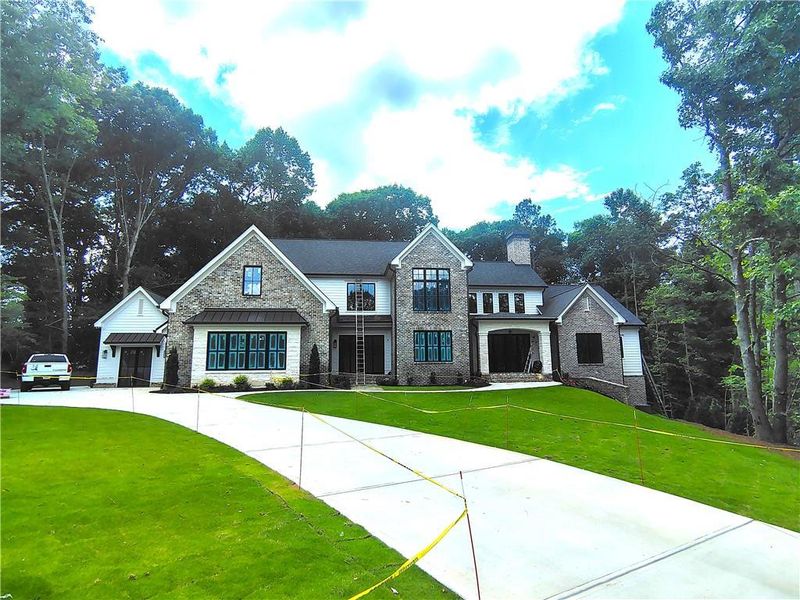 Front exterior of a new home in , Ball Ground, GA, highlighting curb appeal (Image 1). Front exterior of a new home in , Ball Ground, GA, highlighting curb appeal (Image 1).