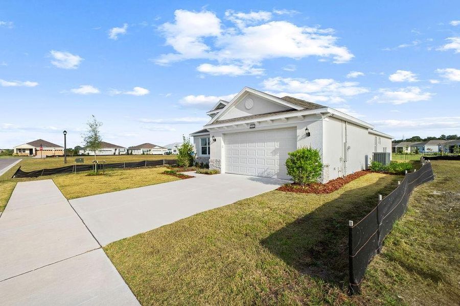 Front exterior of a new home in Lakes of Mount Dora, Mount Dora, FL, highlighting curb appeal (Image 19).