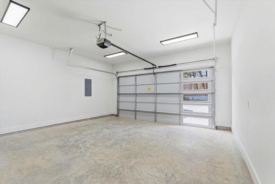 Even the garage offers thoughtful conveniences, including ample lighting, an automatic garage door opener, and easy access to the breaker panel.