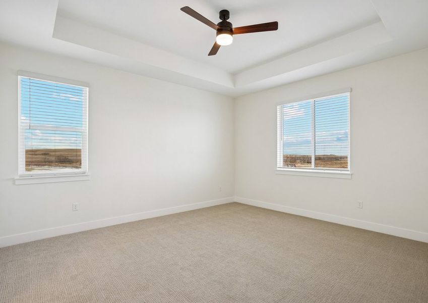 The master bedroom has large windows that let in great, natural light.