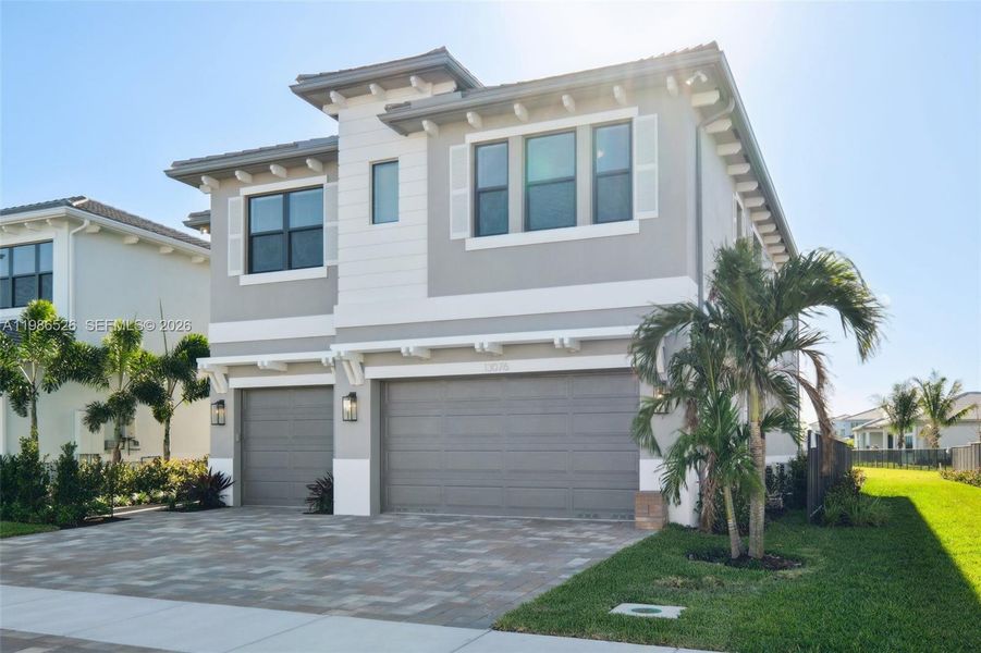 Front exterior of a new home in , Palm Beach Gardens, FL, highlighting curb appeal (Image 26).