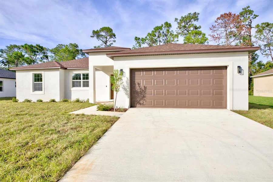 Front exterior of a new home in , Sebring, FL, highlighting curb appeal (Image 17).
