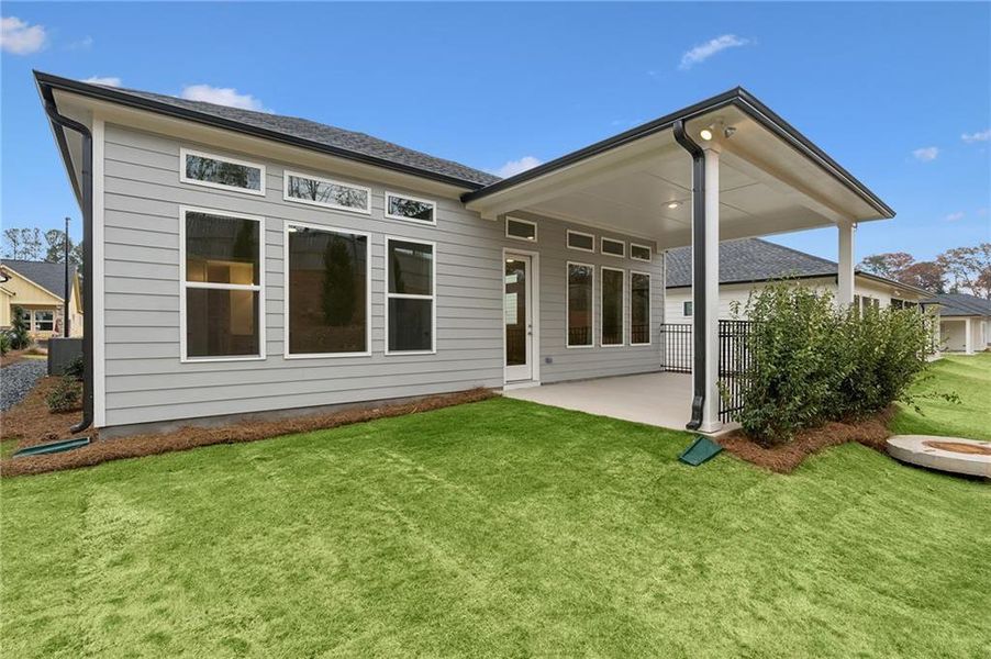 Exterior details and patio area of a home in Maple Grove at Towne Lake, Woodstock (Image 3).