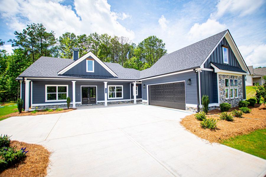 Front exterior of a new home in WOODMONT RESERVE, Roopville, GA, highlighting curb appeal (Image 34).