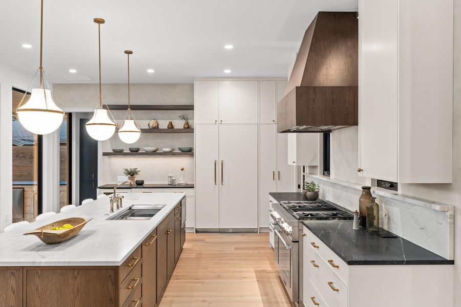 Designed to promote flow and minimize steps for the cook, this kitchen is a workhorse and a design showcase.