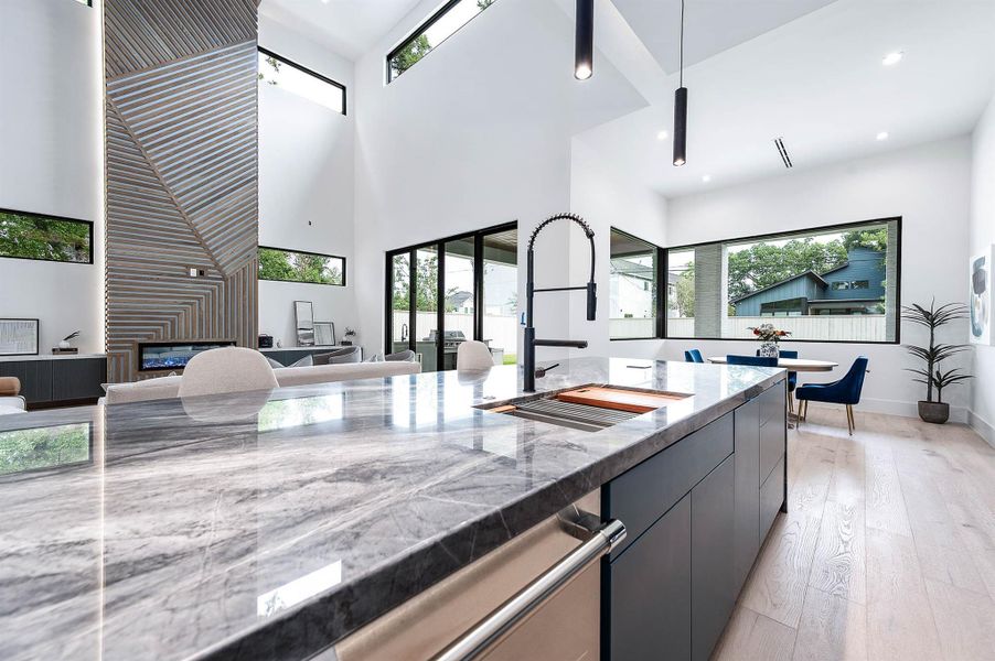 Kitchen open to the living space, designed for seamless entertaining with a spacious layout that encourages socializing and flow between areas.