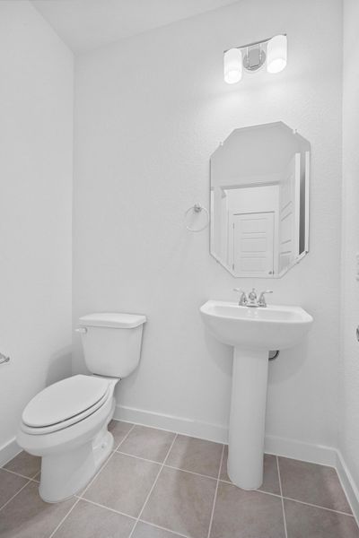 Half Bath in the Oak home plan by Trophy Signature Homes – REPRESENTATIVE PHOTO Half Bath in the Oak home plan by Trophy Signature Homes – REPRESENTATIVE PHOTO