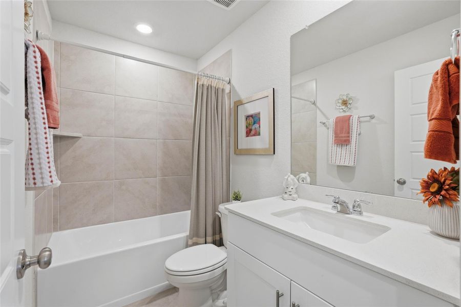 The secondary bathroom is roomy and offers a private area for family and guest to enjoy.