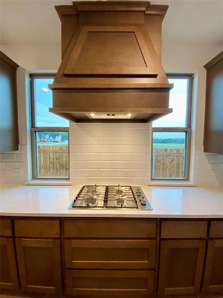 Gas cooktop , custom cabinet vent to outside, and pot & pan drawers. Gas cooktop , custom cabinet vent to outside, and pot & pan drawers.