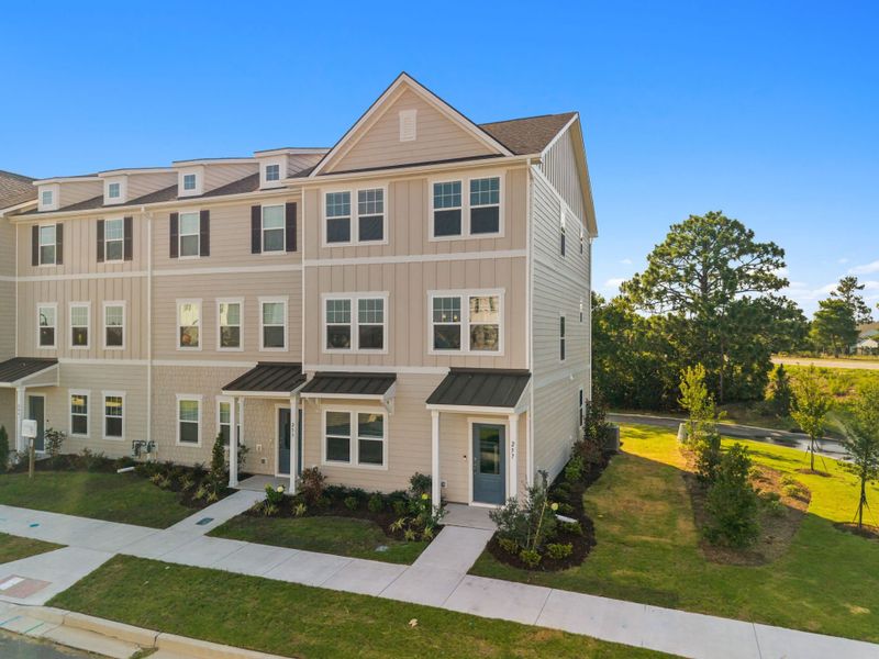 Front exterior of a new home in Lakeside Townes at Riverlights, Wilmington, NC, highlighting curb appeal (Image 1). Front exterior of a new home in Lakeside Townes at Riverlights, Wilmington, NC, highlighting curb appeal (Image 1).