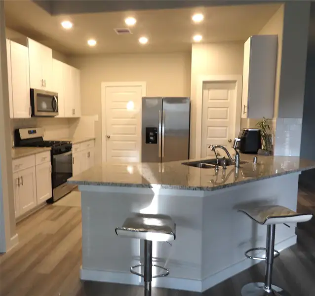 Furnished interior view inside a new home in Sierra Vista, Iowa Colony (Image 4).