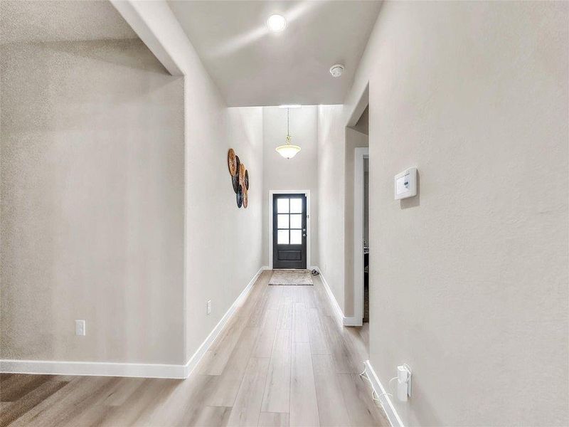 Beautiful two-story exterior with modern architectural details, well-maintained landscaping, and inviting curb appeal in the Bellfort Farms community.