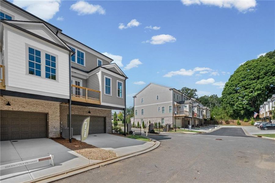 Front exterior of a new home in Devin's Shire, Kennesaw, GA, highlighting curb appeal (Image 20).