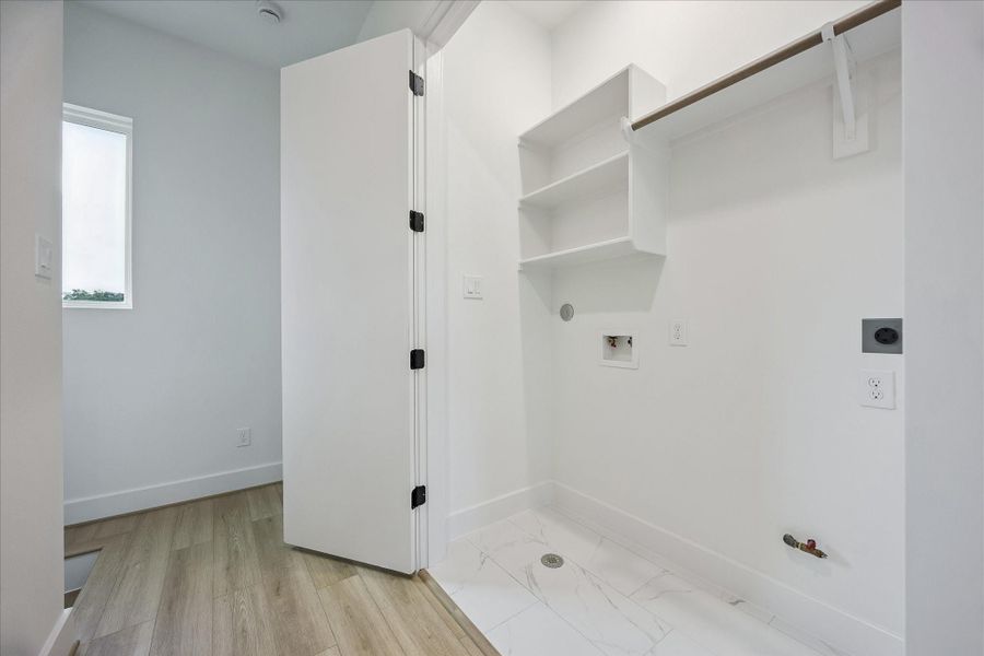 The centrally located utility room is conveniently situated between the bedrooms and is equipped for either a gas or electric dryer. The centrally located utility room is conveniently situated between the bedrooms and is equipped for either a gas or electric dryer.
