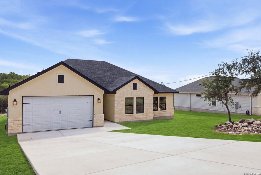 Front exterior of a new home in , Fischer, TX, highlighting curb appeal (Image 2). Front exterior of a new home in , Fischer, TX, highlighting curb appeal (Image 2).