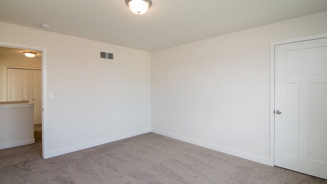 Representative unfurnished interior of a home built from the The Hartland by Norfolk Homes in Coronado Estates, Jackson (Image 76).
