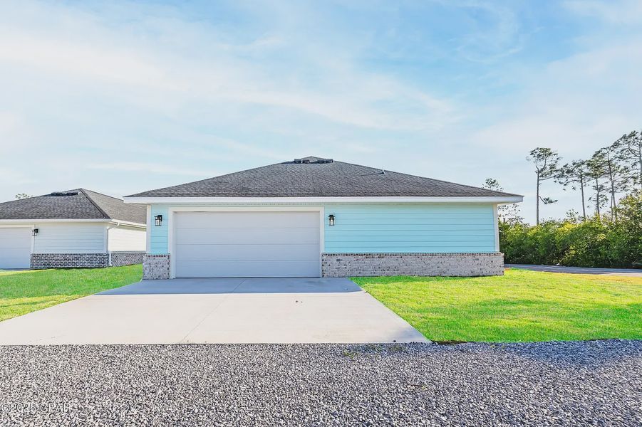 Representative exterior photo of a completed home built from the 2101 by Adams Homes in Alden Springs, Defuniak Springs, FL (Image 16). Representative exterior photo of a completed home built from the 2101 by Adams Homes in Alden Springs, Defuniak Springs, FL (Image 16).