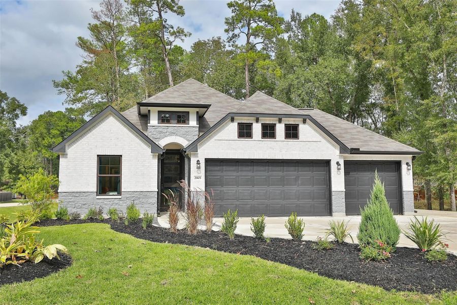 Front exterior of a new home in Roman Forest, New Caney, TX, highlighting curb appeal (Image 20).