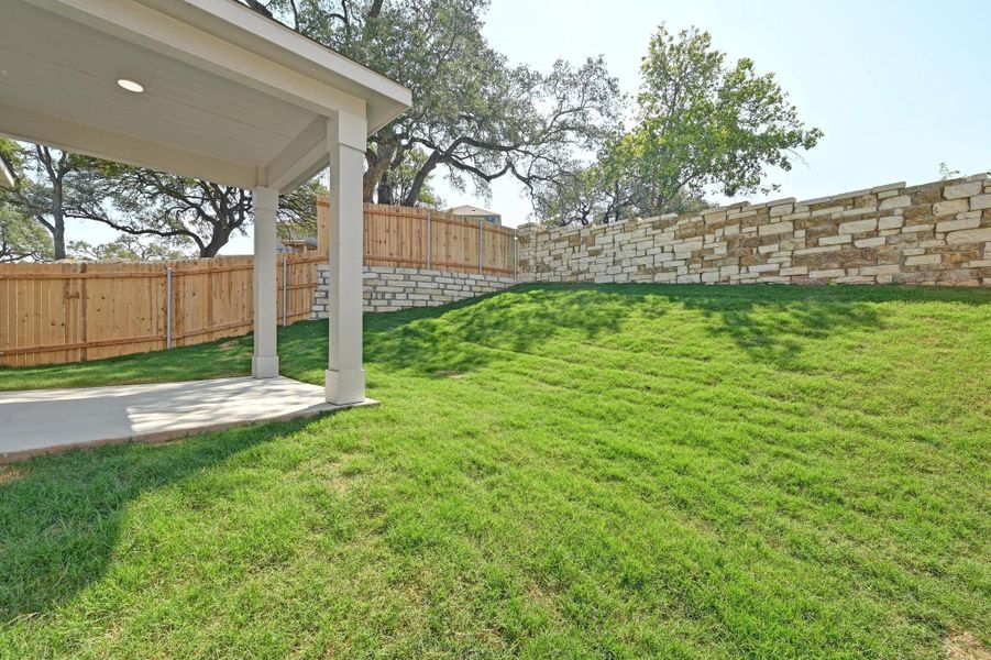 Front exterior of a new home in Creekside at Estancia, Austin, TX, highlighting curb appeal (Image 22).