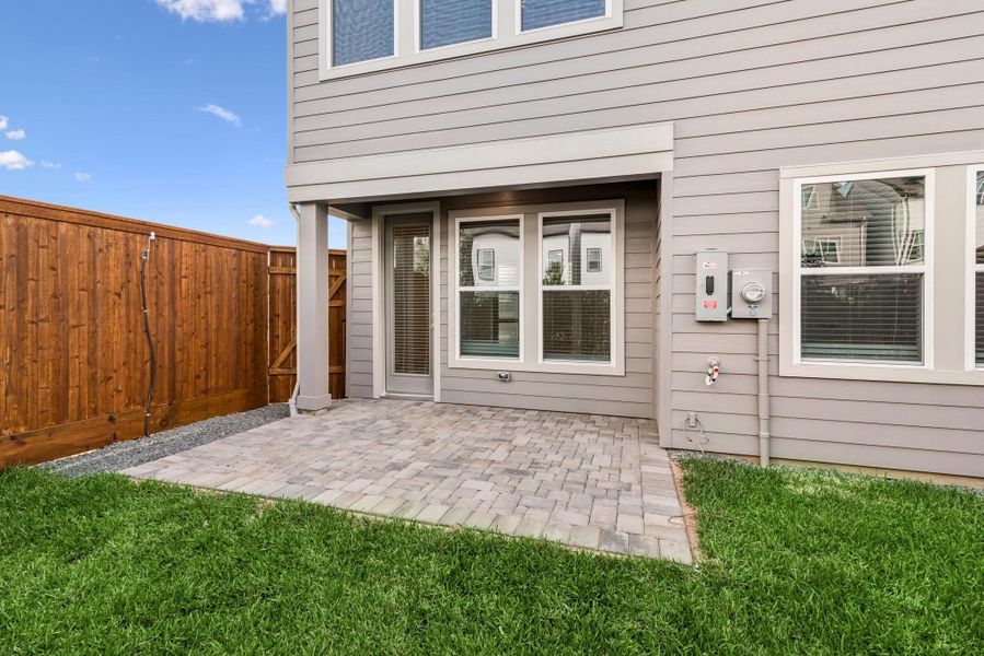 Exterior details and patio area of a home in Retreat at Oak Park, Houston (Image 24).