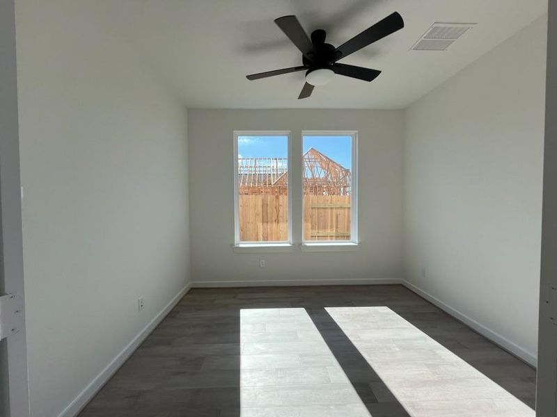 A private study with elegant French glass doors provides the perfect space for work or relaxation.