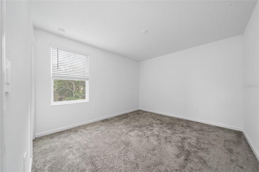 Spacious, unfurnished interior of a new home in Storey Creek, Kissimmee (Image 22).