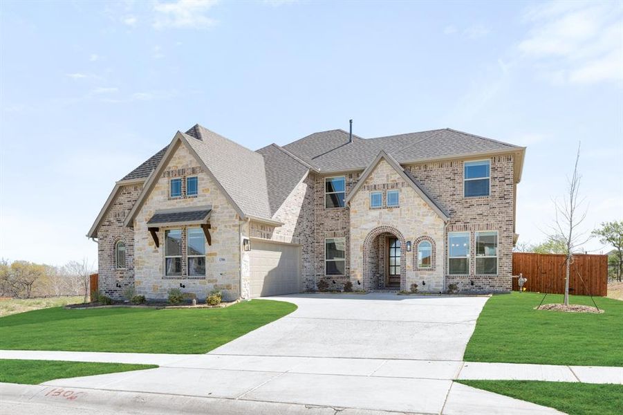 Front exterior of a new home in Timberbrook, Justin, TX, highlighting curb appeal (Image 2).