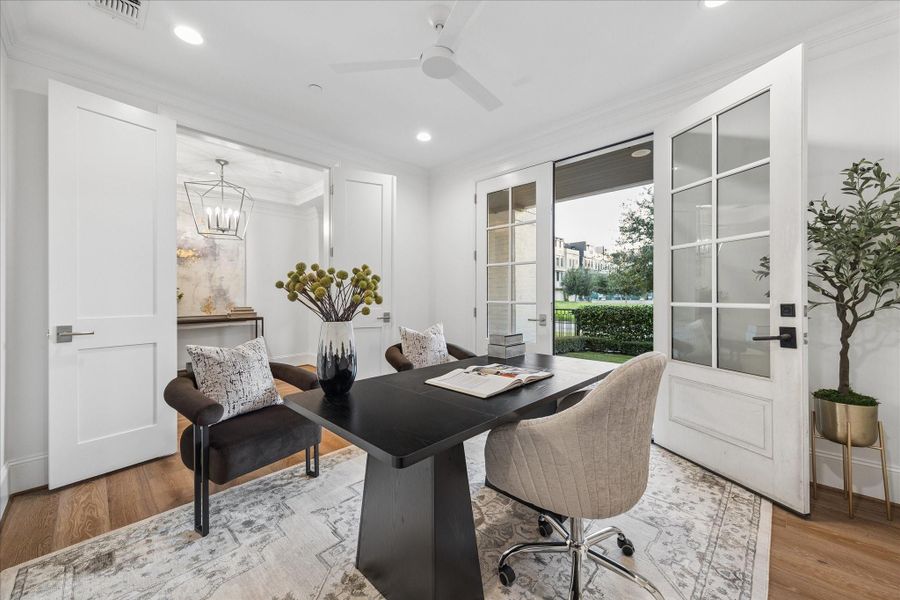 French doors open to the front yard that's private and fenced.