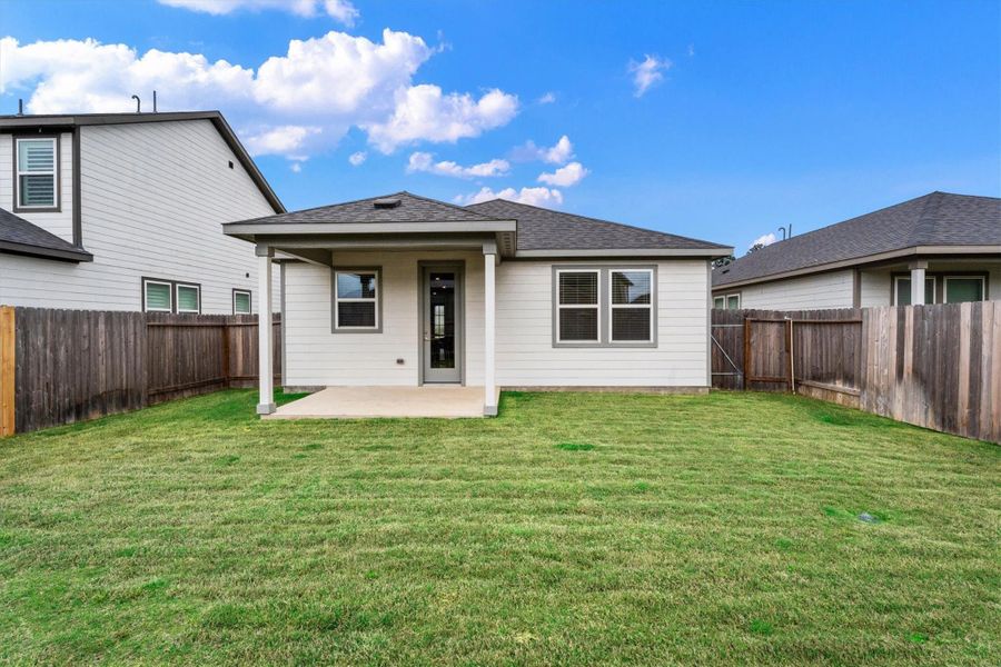 Exterior details and patio area of a home in Mason Woods, Cypress (Image 25).