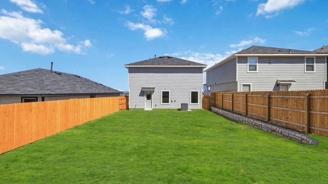 Exterior details and patio area of a home in Wayside, Uhland (Image 4).