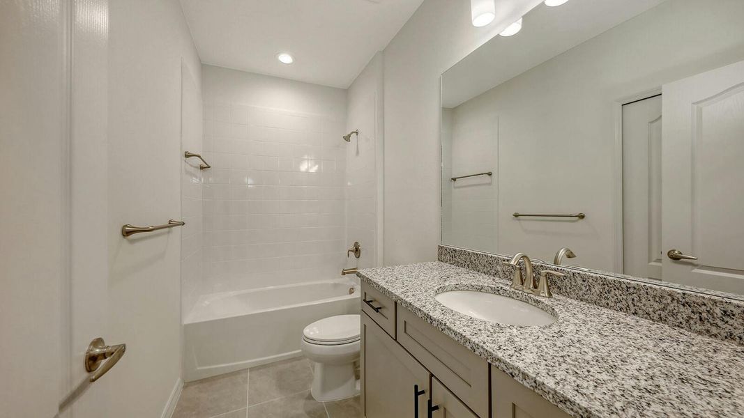 Furnished interior view inside a new home in Palm Grove Real Estate and Homes for Sale in Lakewood Ranch, FL - Neal Communities, Lakewood Ranch (Image 15).